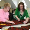 Master craftspeople making a kilt at the Gaelic College of Celtic Arts and Crafts