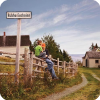 Gaelic sign along the road at the Highland Village / An Clachan Gàidhealach