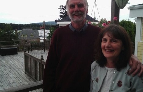 Maurice and Anne Fowler of Australia visit MacLeod House in Baddeck, the original location of Charles J. Campbell’s home in the 1880’s. Campbell was Fowler’s great-great grand uncle. In the distance behind the Fowlers is the roof Baddeck’s Old Post Office, which contains a stone image of Campbell. The Baddeck & Area Historical Society hosted a reception for the Fowlers when they visited in the summer of 2013.